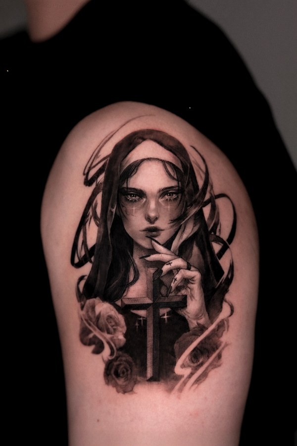 A portrait of a woman tattooed on the arm