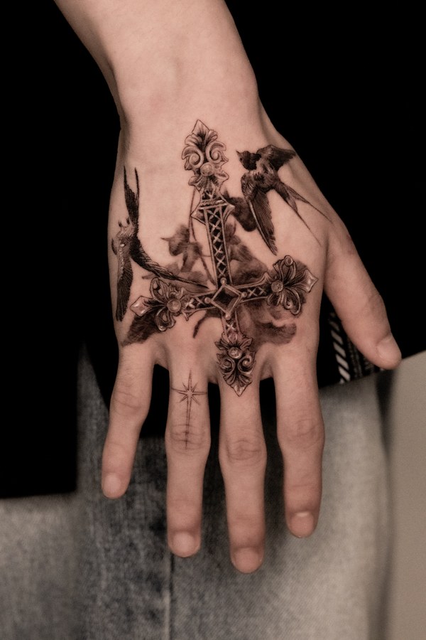 An angel tattooed on the back of the hand