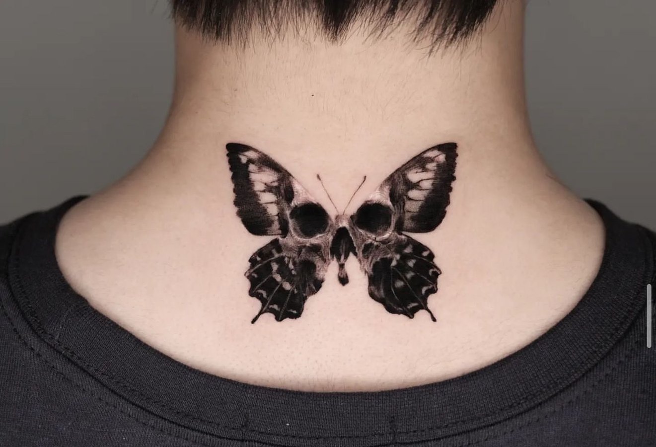 A butterfly tattooed on the nape